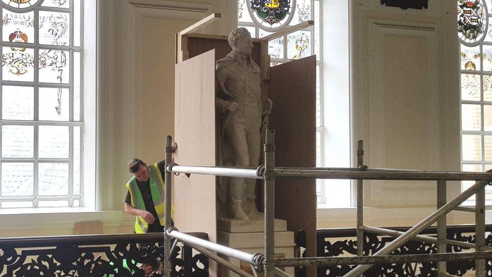 Workman boxing off Sir Thomas Picton statue at Cardiff City Hall