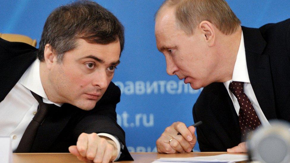 Vladimir Putin confers with his then deputy Vladislav Surkov in 2012