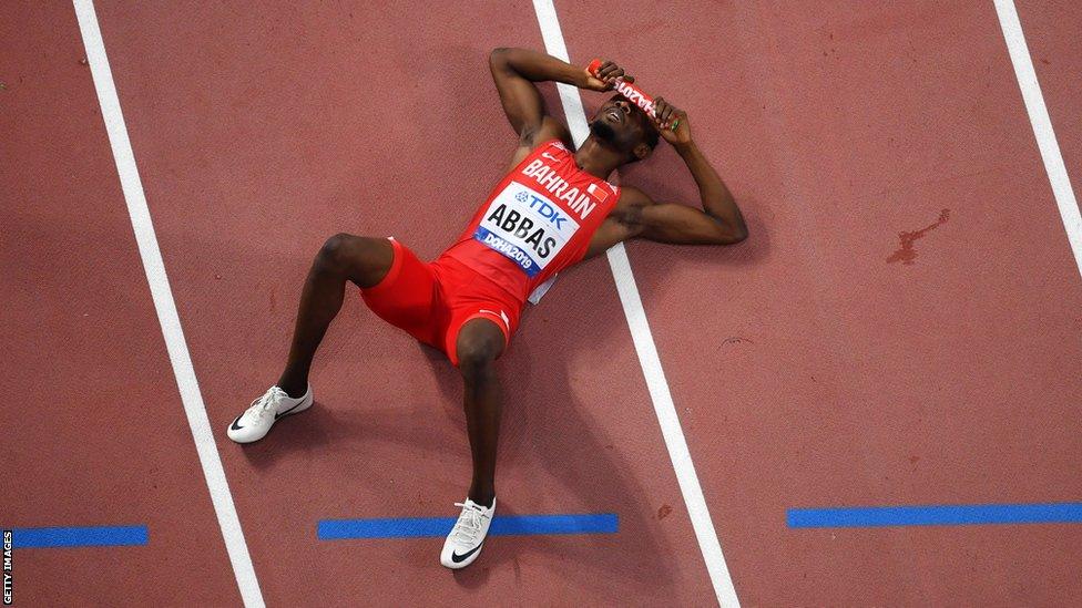 Nigeria-born Bahraini athlete Abbas Abubakar Abbas lying on the track after finishing a relay