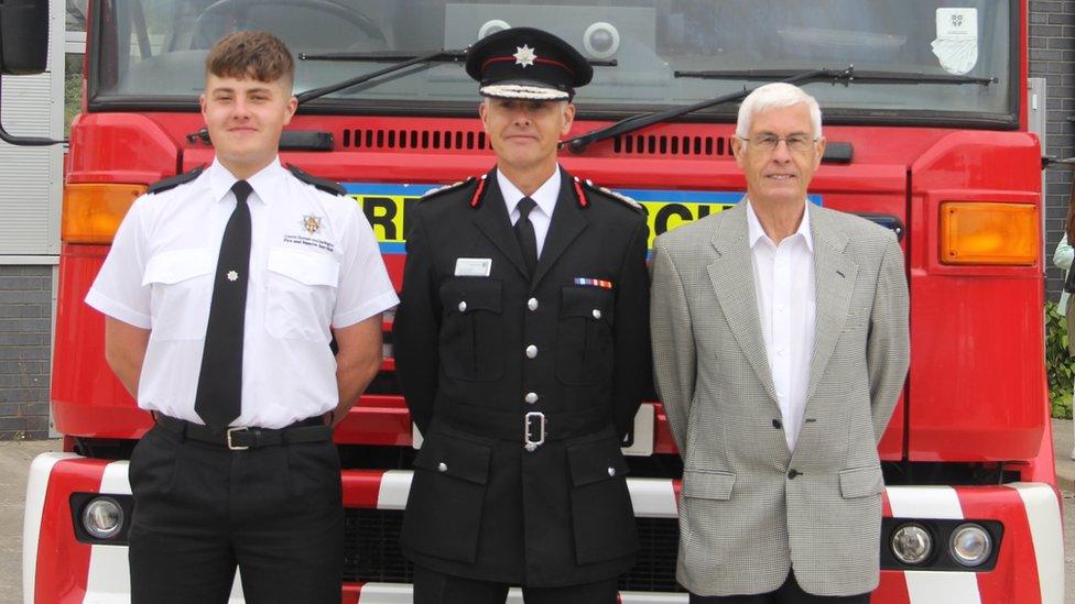 Alex, Matthew and Eddie stand in front of a fire engine