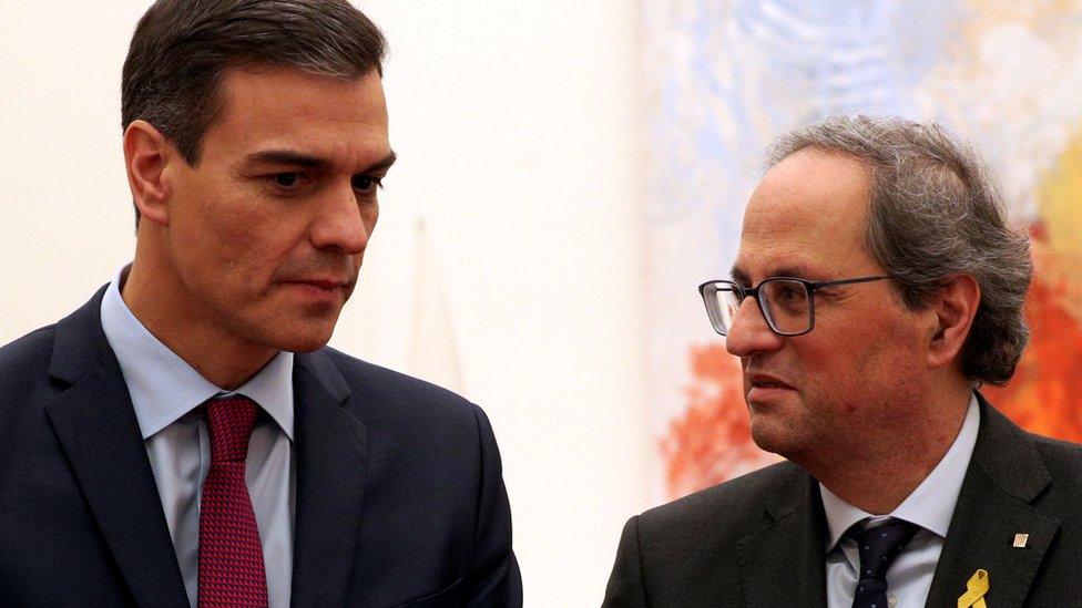 Prime Minister Pedro Sanchez and Catalan Regional President Quim Torra talk after a meeting at Palau Reial de Pedralbes in Barcelona, Spain December 20, 2018