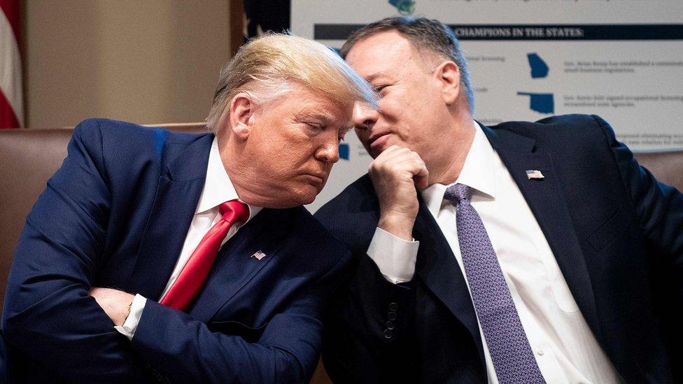 US President Donald Trump listens to US Secretary of State Mike Pompeo during a cabinet meeting at the White House