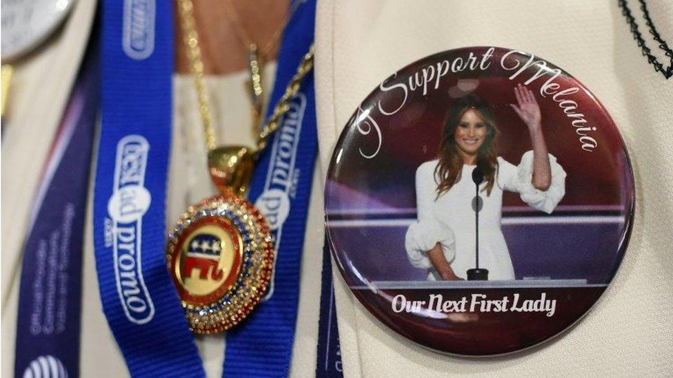 A delegate sports a pin featuring Donald Trump's wife Melania on the second day of the Republican National Convention on July 19, 2016