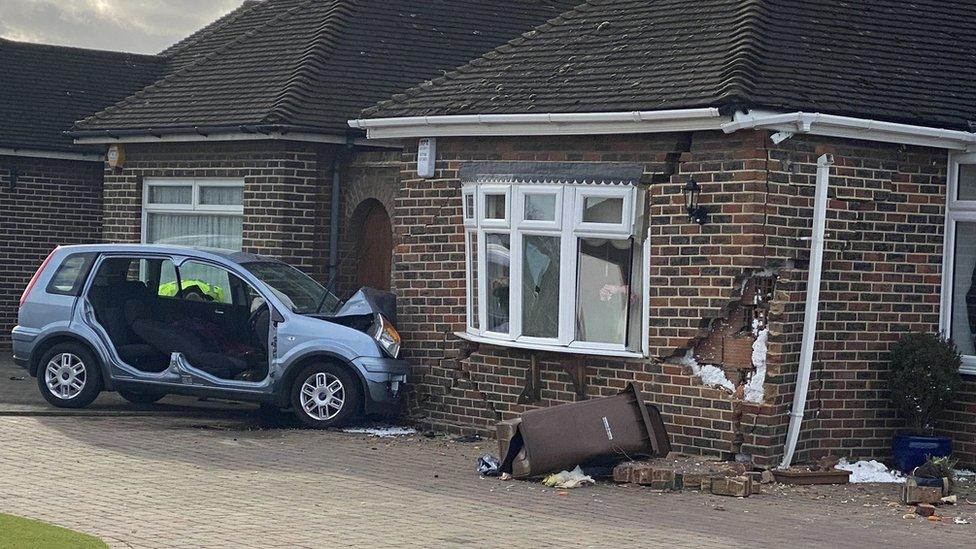 Car crashed into house