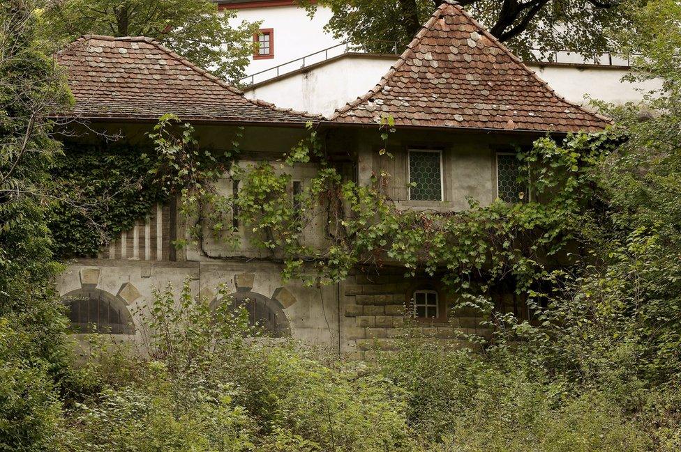 A former infantry bunker is camouflaged as a medieval house in the town of Duggingen, Switzerland