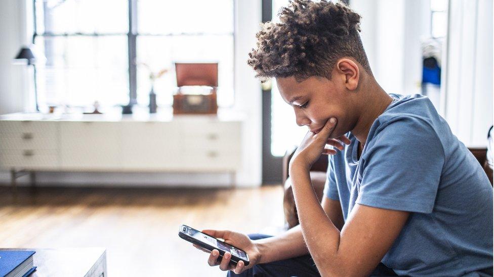 Boy looking at phone