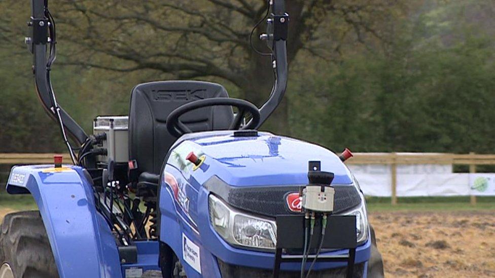 Robot tractor rolls the field