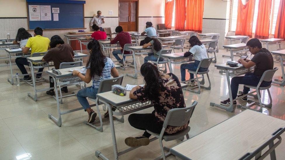 A teacher takes a class of the students as schools in Maharashtra reopen after being shut for over a year-and-a-half in the wake of the Covid-19 pandemic, on October 4, 2021 in Mumbai, India.