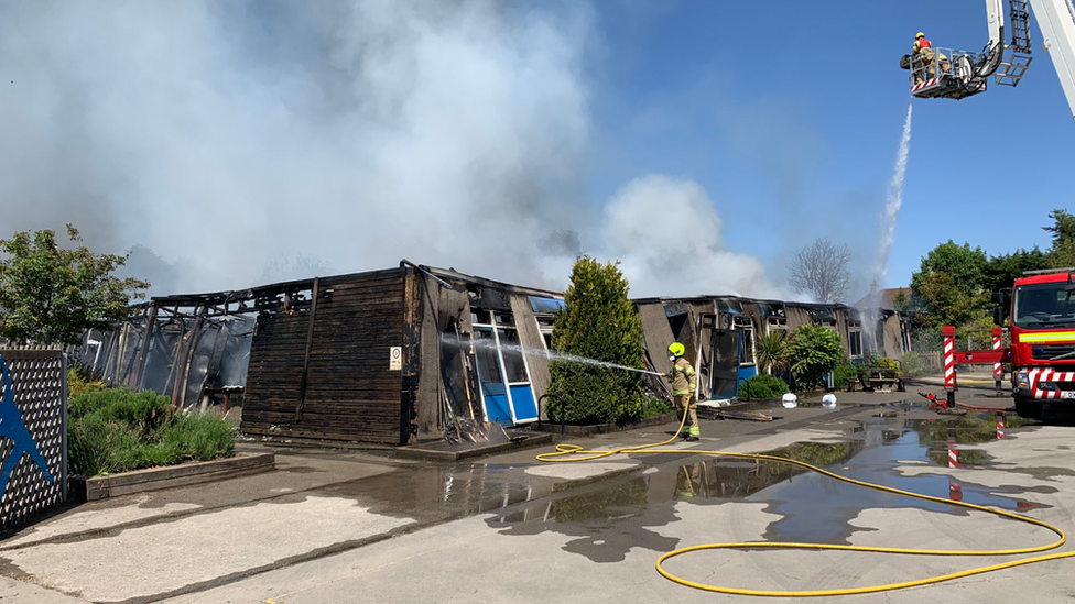 Firefighters putting out flames