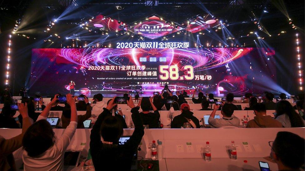 A giant screen shows sales information from Tmall, Alibaba's online marketplace