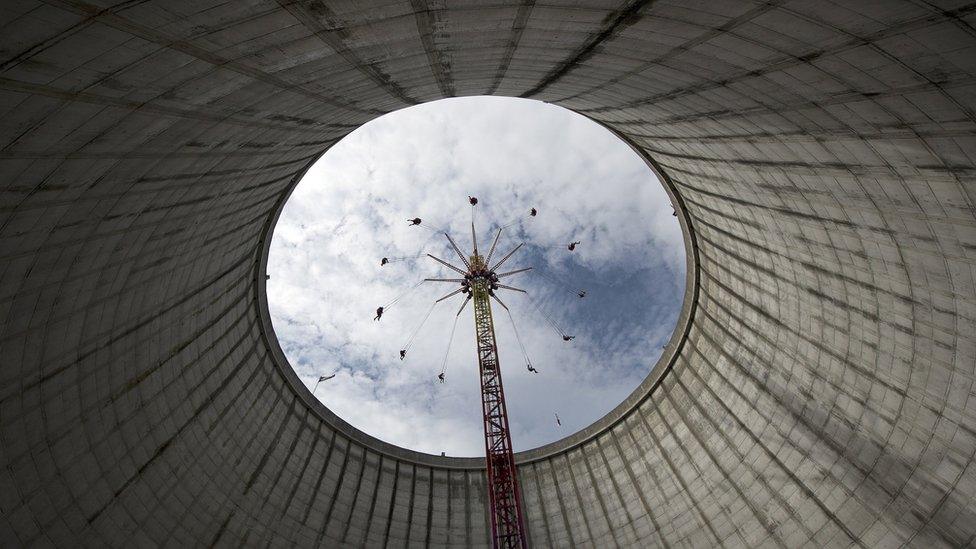 A merry-go-round turns inside of the cooling tower of the former nuclear power plant in Kalkar, western Germany