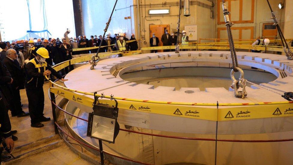 Members of the media and officials tour the heavy water nuclear reactor at the Arak Nuclear Power Plant in Iran (23 December 2019)