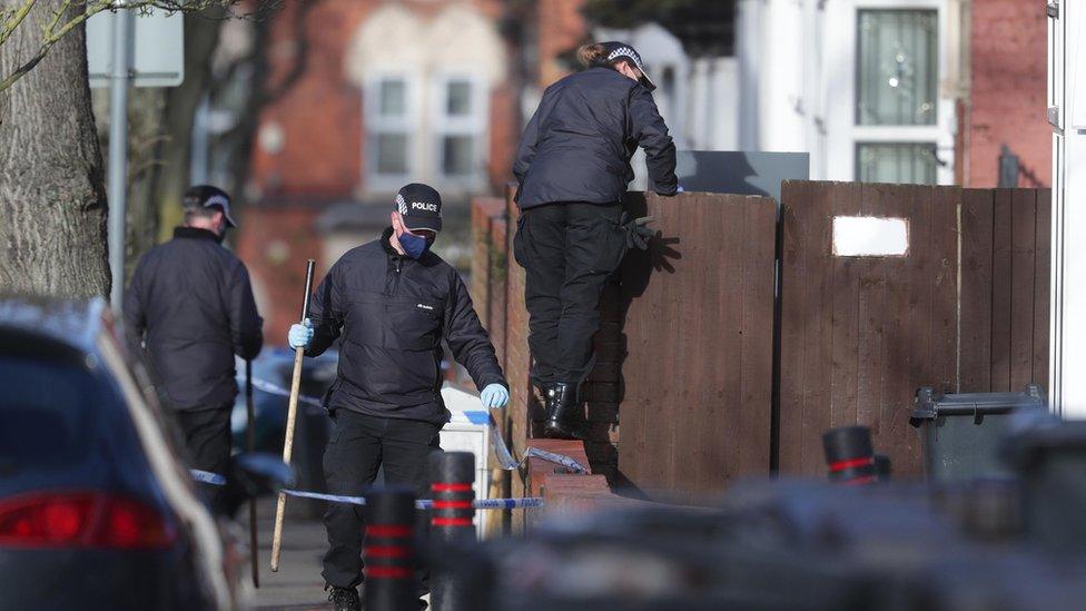 Police officers searching the scene in Linwood Road, Handsworth