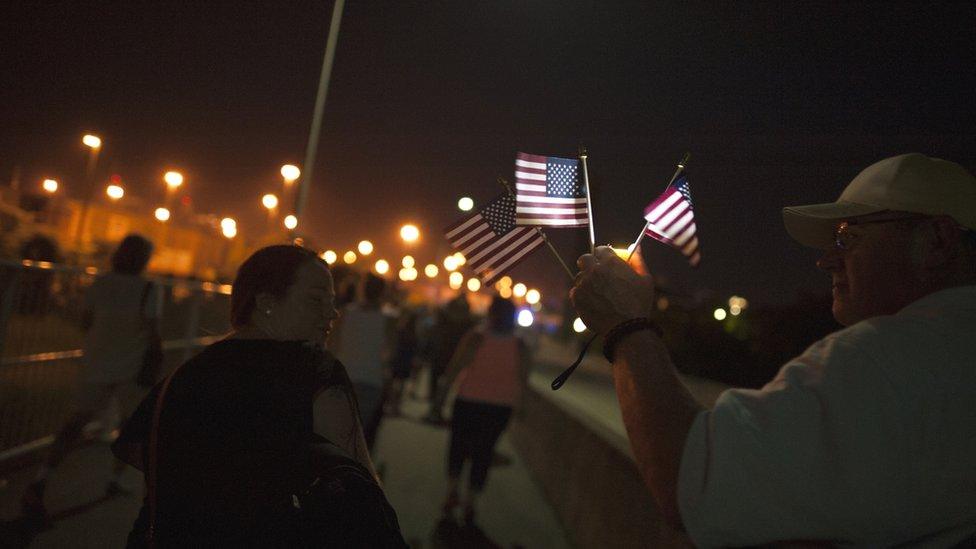 2015-06-21. An estimated three thousand members of the public gathered on Ravenal bridge in Charleston on Sunday in a show of unity after nine black worshipers were murdered during a prayer meeting the previous Wednesday. Colm O'Molloy for BBC News.