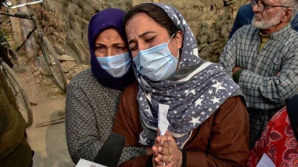 Wife of slain Mudasir Gull weeps and pleads during a protest demanding the return of the bodies of Altaf and Mudasir Gull