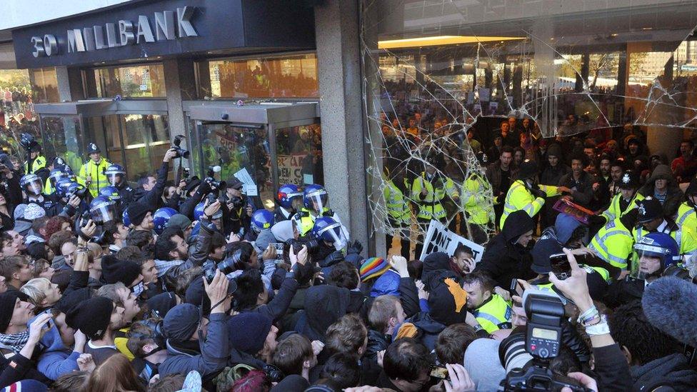 Police and demonstrators confront each at Millbank