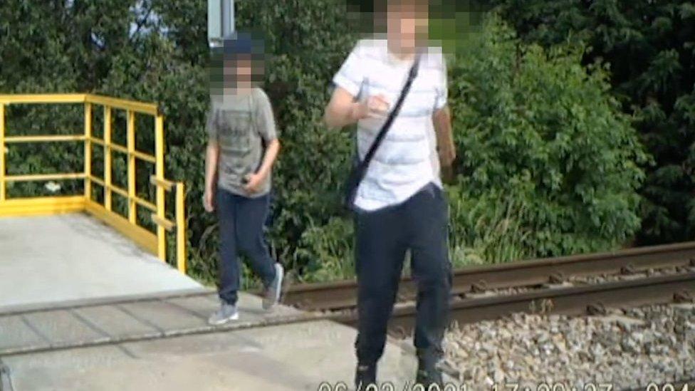 Children playing on railway line