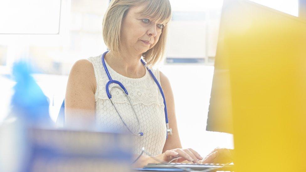 Doctor writing letter about a patient