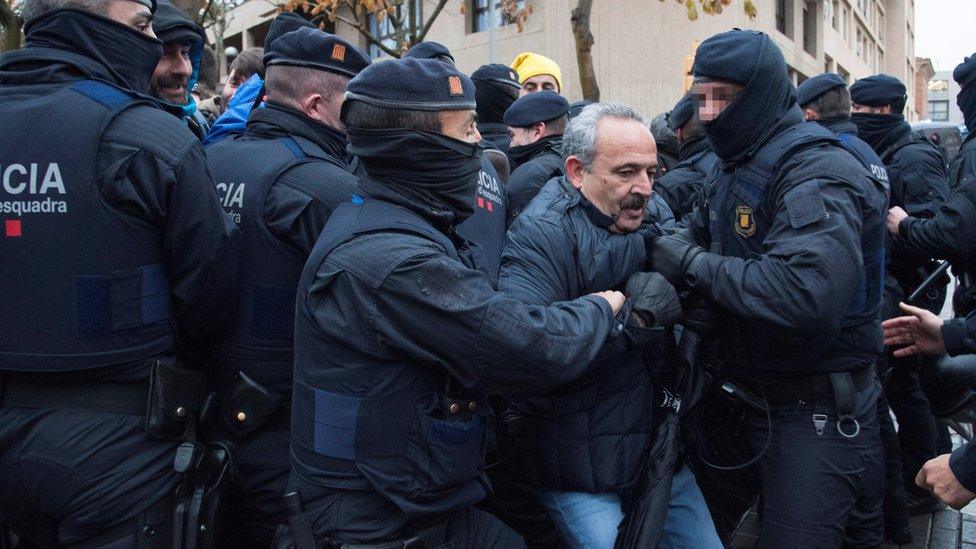 Spanish demonstrators scuffle with members of the Catalonian regional Police (Mossos d"Esquadra) outside of the Lleida Museum, in Lleida