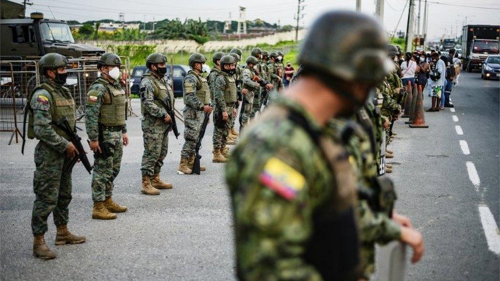 Soldier stand guard outside a prison where inmates were killed during a riot that the government described as a concerted action by criminal organisations, in Guayaquil, Ecuador February 23, 2021.