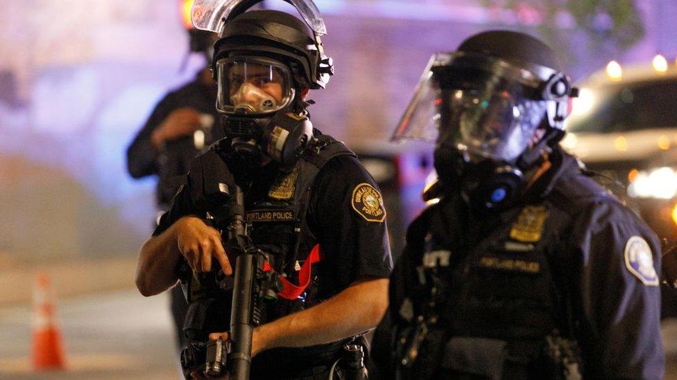 Police arrest demonstrators as Black Lives Matter supporters demonstrate in Portland, Oregon on July 4, 2020 for the thirty-eighth day in a row at Portland's Justice Center and throughout Portland