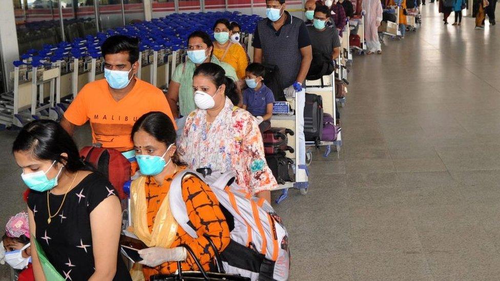 Indian citizens queue at Kuwait International Airport