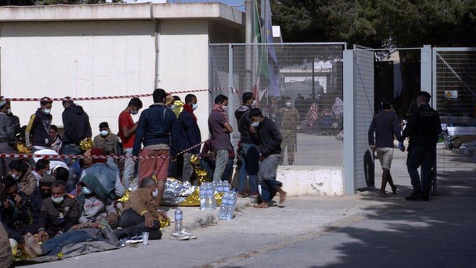 Group of migrants sleeping outside the camp