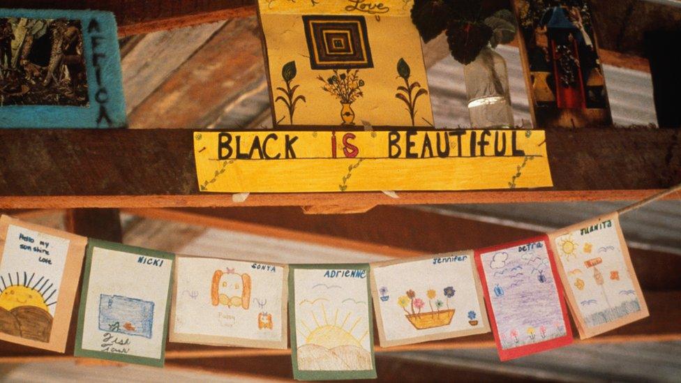 A school decoration, photographed after, saying Black is Beautiful