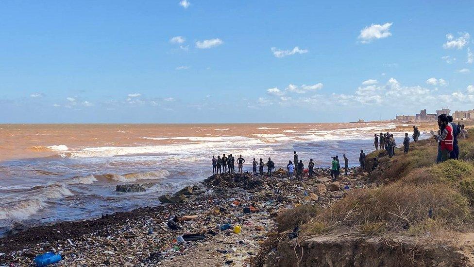 Rescue teams and the Libyan Red Crescent search for victims in the sea