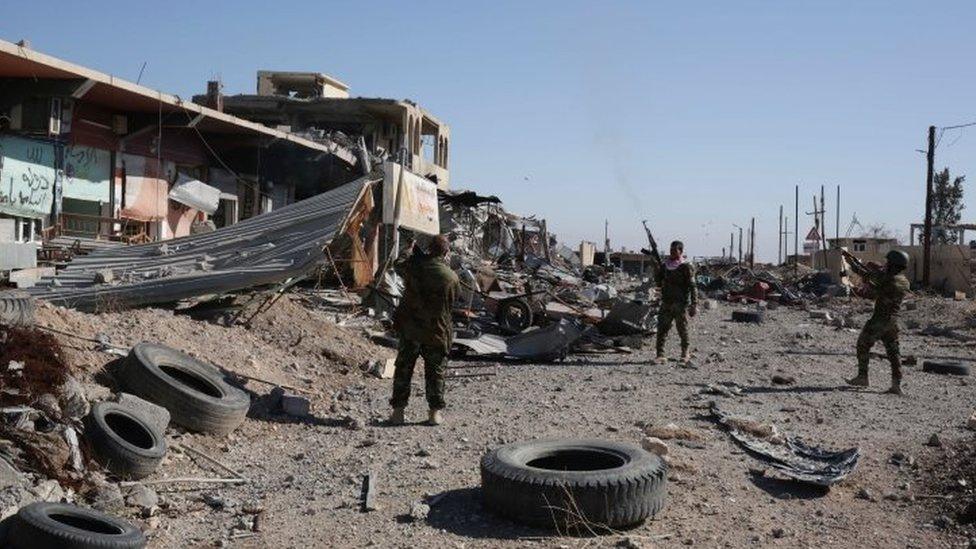 Kurdish Peshmerga fighters in Sinjar celebrate by firing into the air. Photo: 13 November 2015