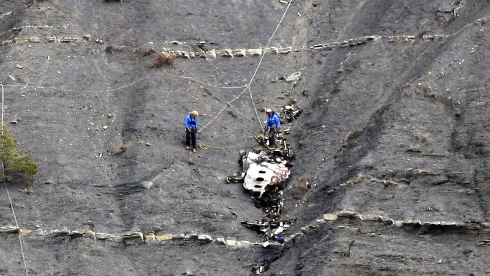 Members of the rescue team work at the crash site of the Germanwings Airbus A320 near Seyne-les-Alpes, France