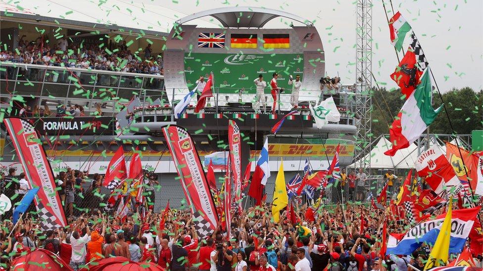 Nico Rosberg of Mercedes, Sebastian Vettel of Ferrari and Lewis Hamilton of Mercedes GP celebrate on the podium at the Italian Grand Prix on Sunday