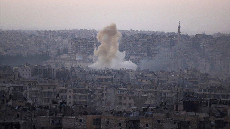 Smoke rises from Bustan al-Basha neighborhood of Aleppo