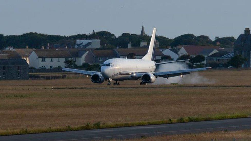 Plane landing at Isle of Man Airport