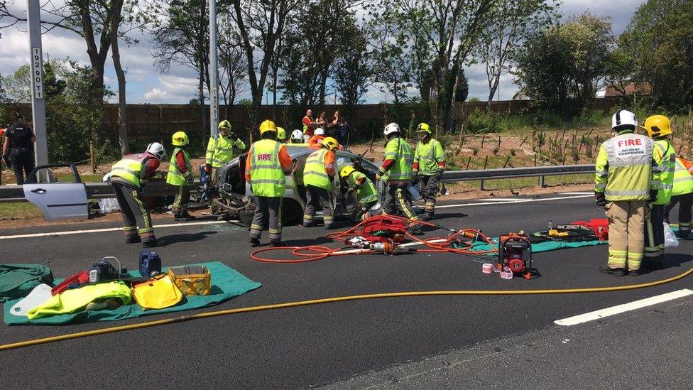 Firefighters at the scene of the crash