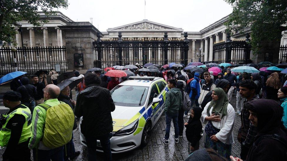 Visitors stood outside the museum during the police response