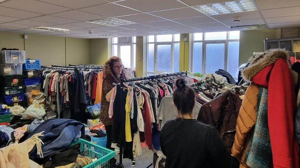 Rachael Liddle sorting clothes