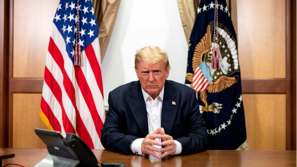 US President Donald Trump participates in a phone call at Walter Reed National Military Medical Center.