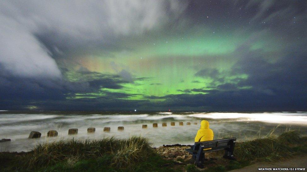 Green aurora in a gap in the clouds in Lossiemouth.