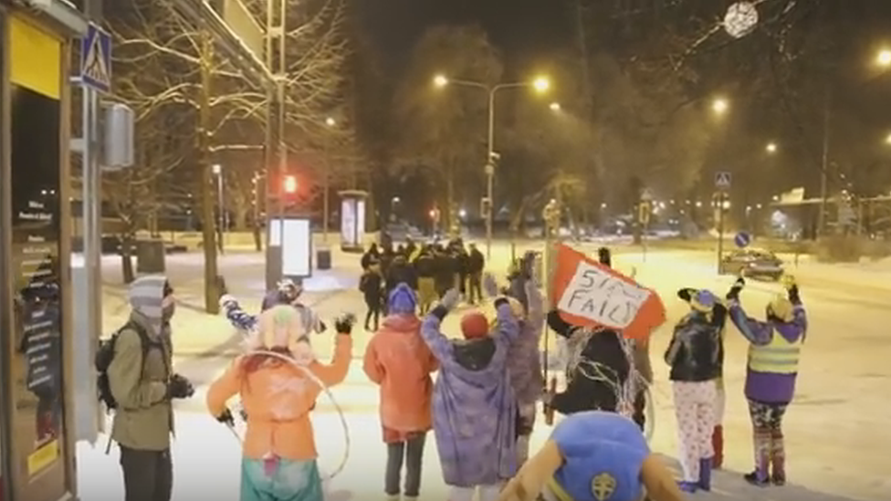 The clowns wave goodbye to the Soldiers of Odin street patrol