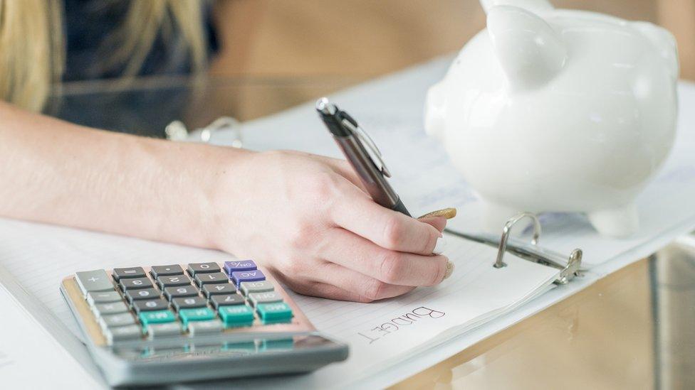 Child making a budget list