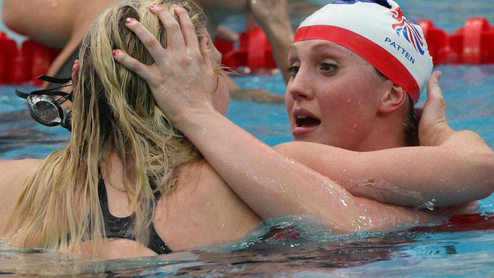 Cassie Patten hugging Rebecca Adlington in the pool