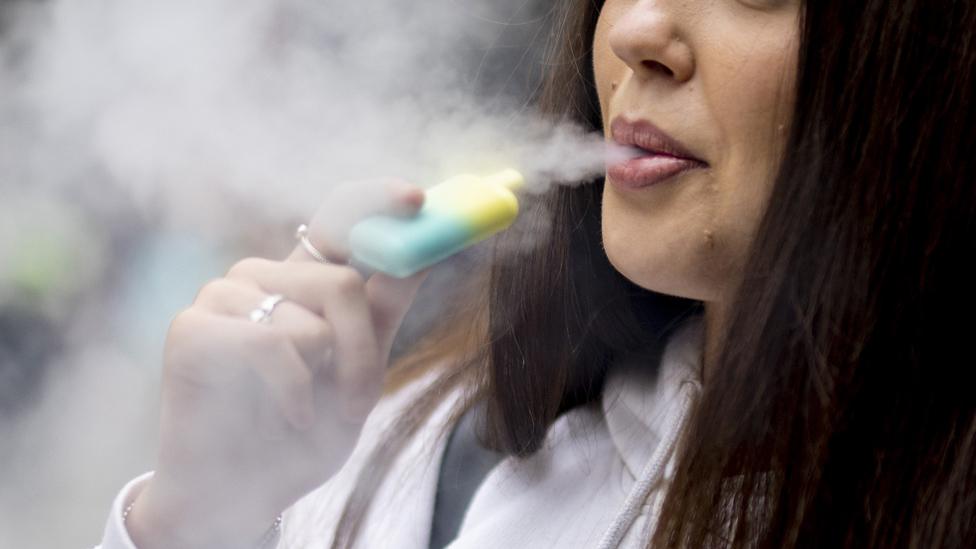 Woman vaping in London