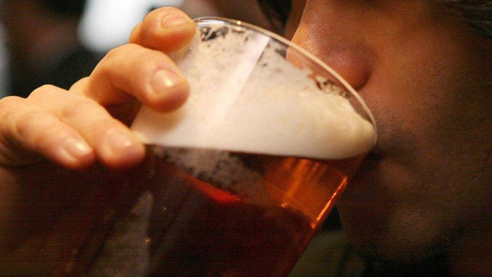 Man drinking a pint of beer