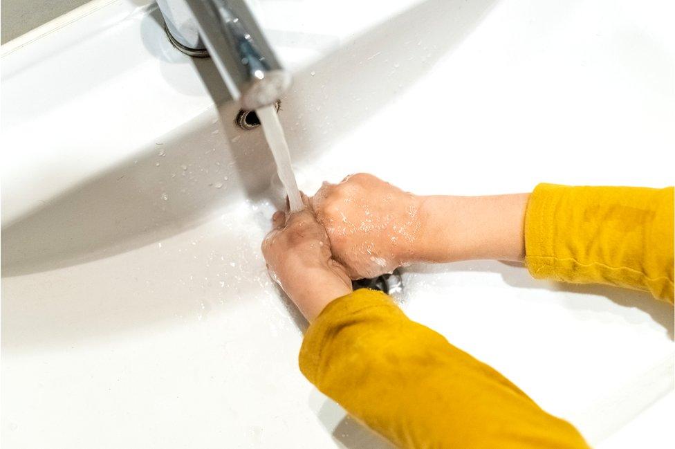 Child washing hands