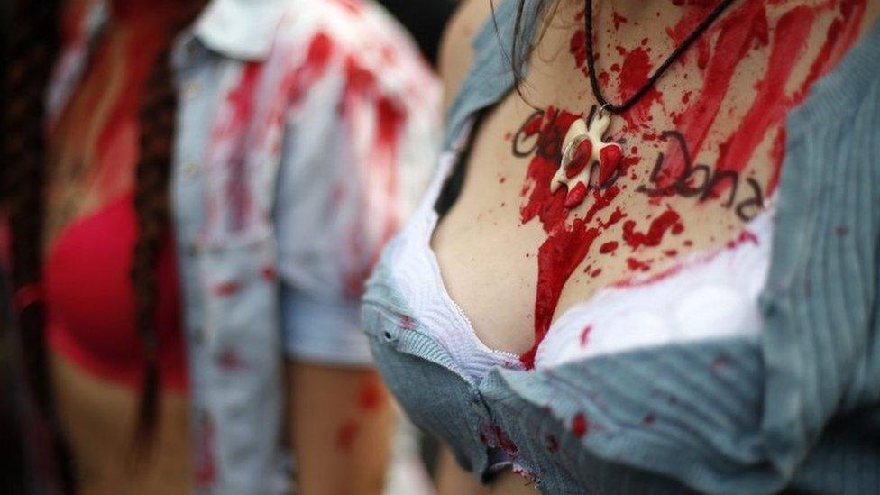 Women participate in a protest against gender violence in Santiago, Chile, 19 October 2016