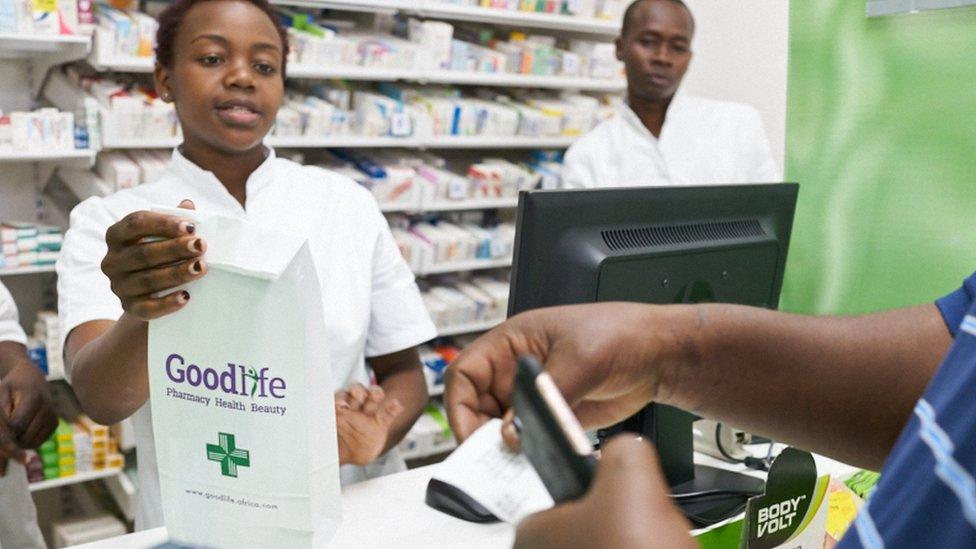 A Goodlife pharmacy employee serving a customer