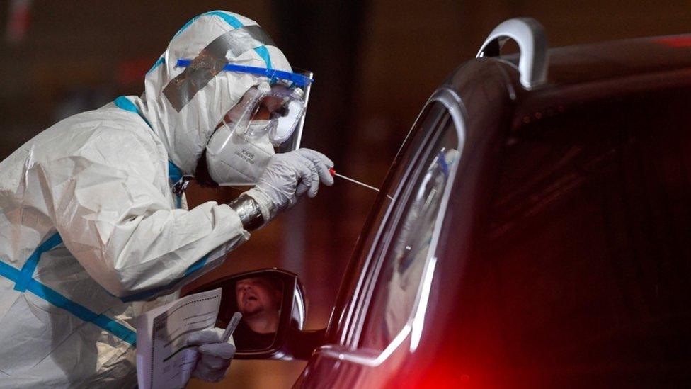 A health worker tests a driver in Guetersloh