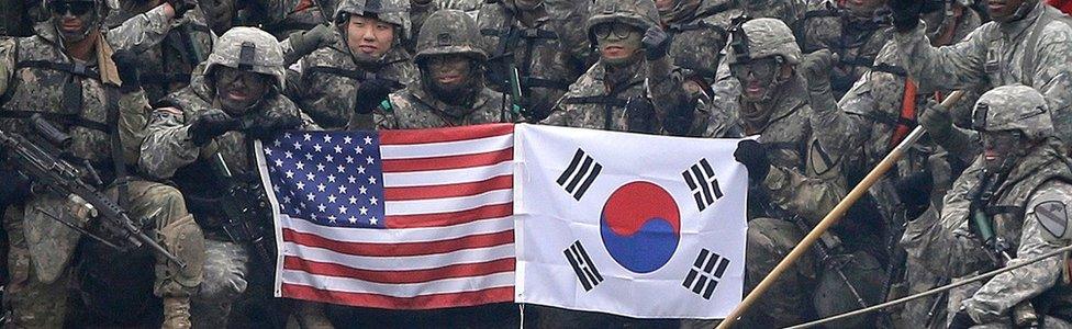 US and South Korean army soldiers pose on a floating bridge on the Hantan river during a joint military exercise against a possible attack from North Korea, in Yeoncheon, South Korea on 10 December, 2015