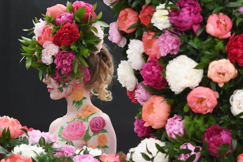 A model poses at Chelsea Flower Show